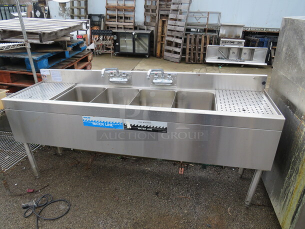 One Glastender 4 Well Bar Sink With R/L Drain Board And 2 Faucets. Model# FS-72S.  72X39X34 $2679.00
