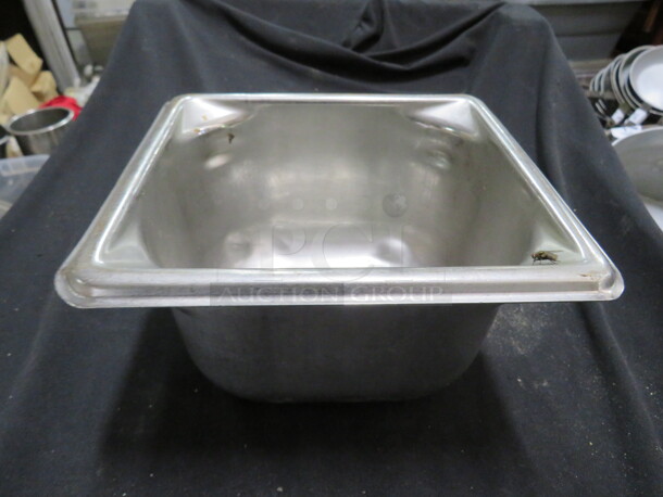 One 1/6 Size 4 Inch Deep Stainless Hotel Pan.