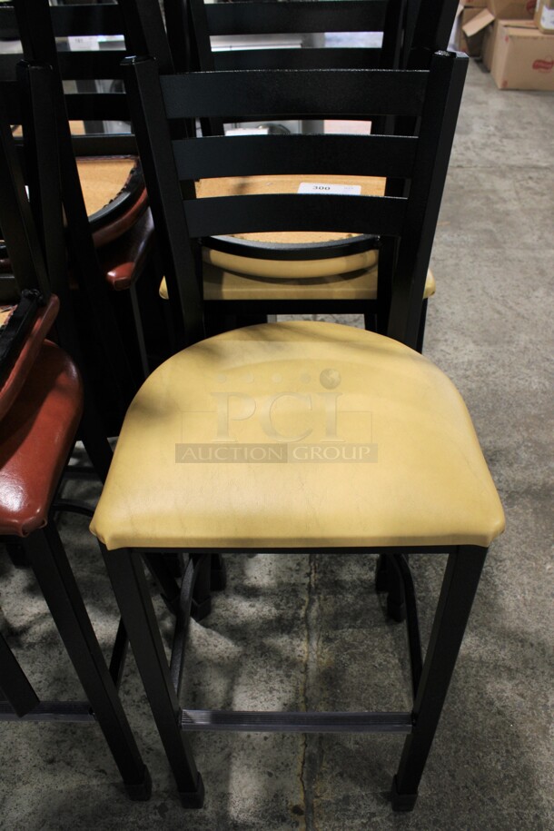 2 Black Metal Bar Height Chairs w/ Yellow/Tan Seat Cushion. 17x16x43. 2 Times Your Bid!