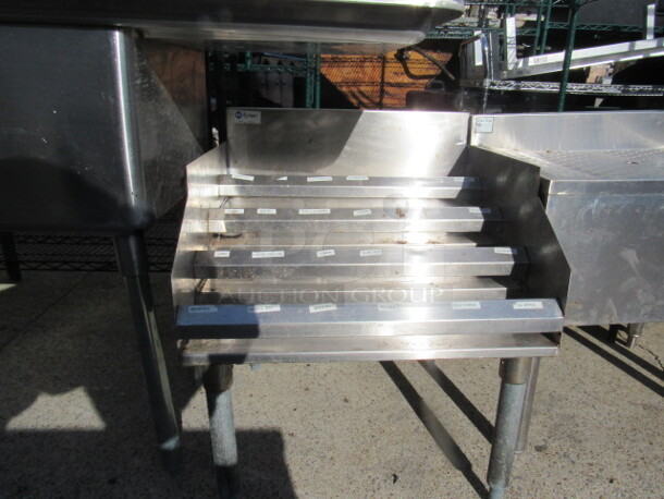 One Stainless Steel 4 Tier Under Bar Bottle Display Unit. 24X4X27. $798.00