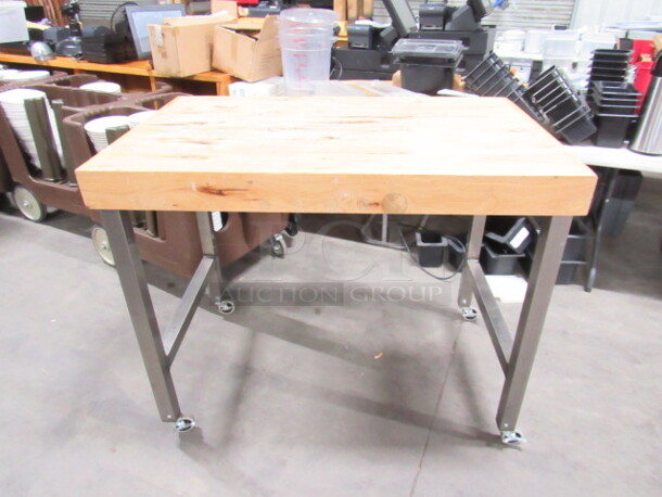 One AWESOME Industrial Look Solid Wood Table On A Heavy Duty Metal Base On Casters.