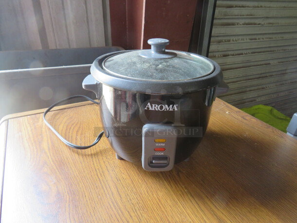 One Aroma 3 Cup Rice Cooker. Model# ARC-383NGB. 120 Volt.  - Image 1 of 1