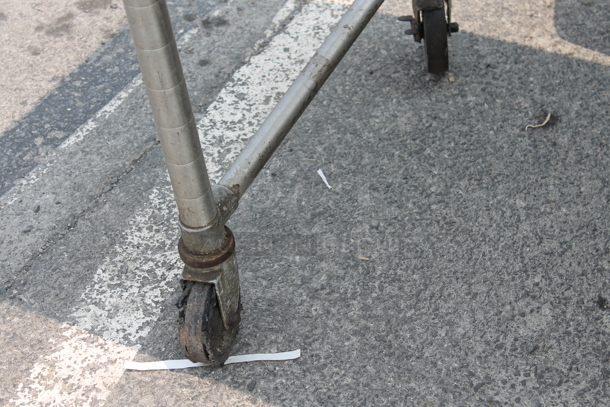 Stainless Steel Commercial Table w/ Back Splash and 2 Under Shelves on Commercial Casters. One Caster Needs To Be Reattached. - Image 3 of 3
