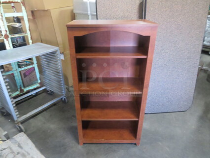 One Brown Laminate 4 Shelf Bookcase. 25X13X48