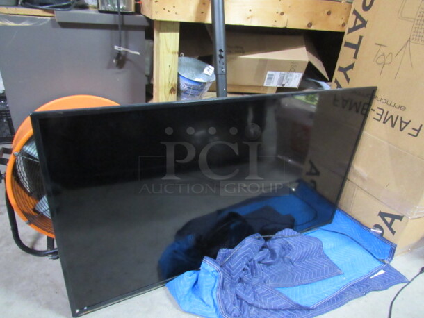One WBOX Technologies 65 Inch Flatscreen TV With Remote And Ceiling Mount Pole # 65L73ATC-16AH8001-002561.