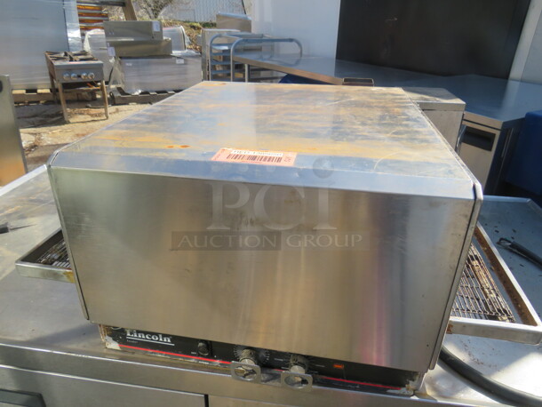 One Lincoln Impinger Countertop Pizza Oven. Model# 1301-4. 208 Volt. 36X32X18