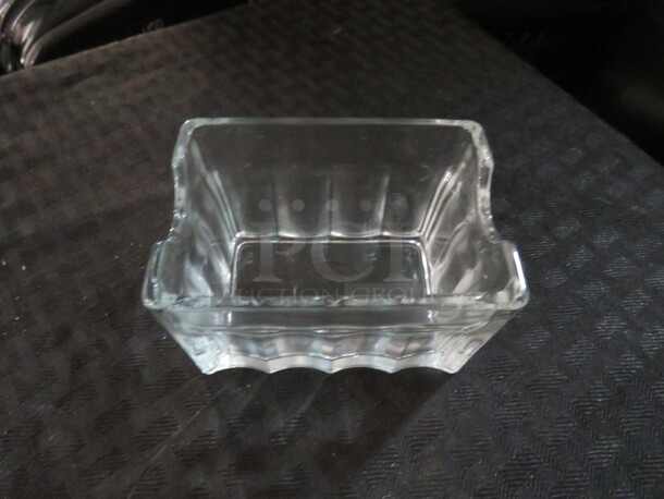 One Lot Of 24 Glass Sugar Pack Holders.