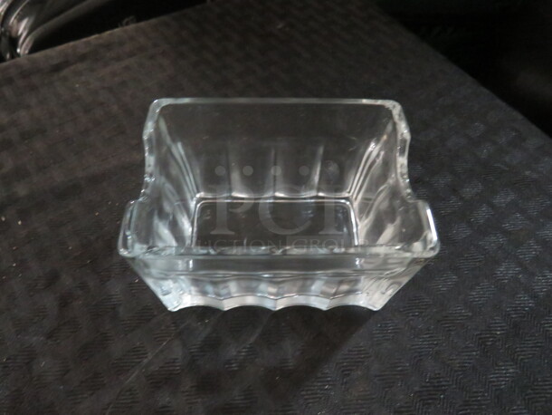 One Lot Of 24 Glass Sugar Pack Holders. - Image 1 of 1