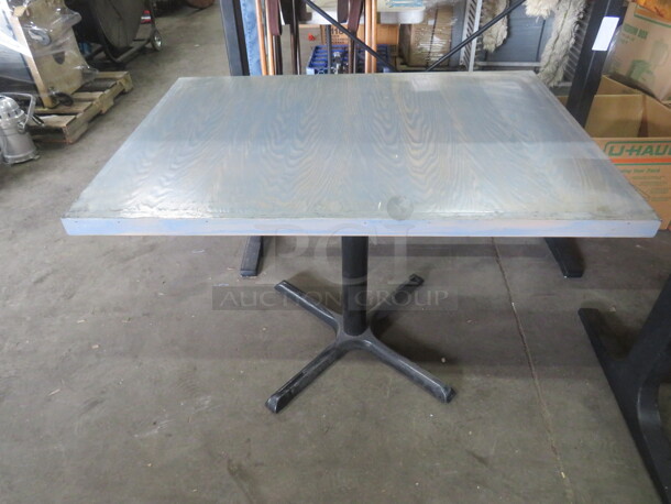 One Wooden Table Top In A Gray Finish On A Pedestal Base. 42X30X29