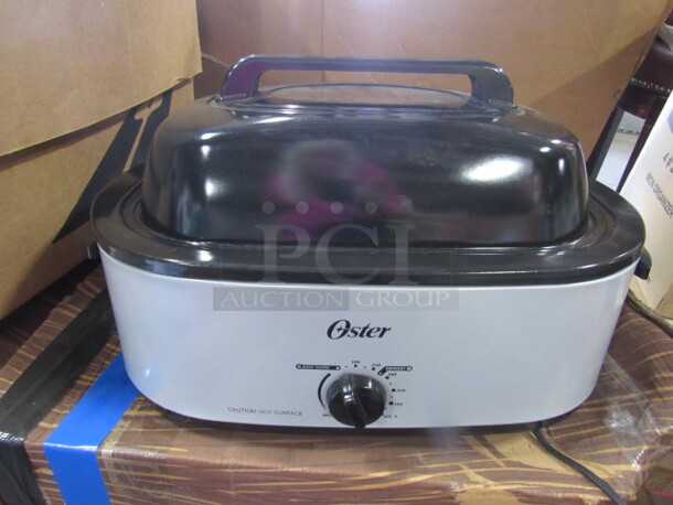 One NEW Oster Roaster With Lid.