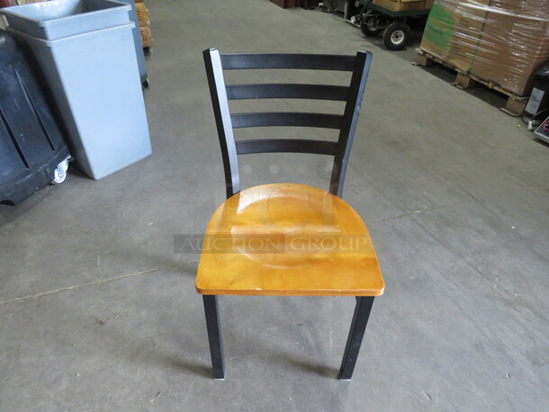 Black Metal Chair With A Wooden Seat. 4XBID