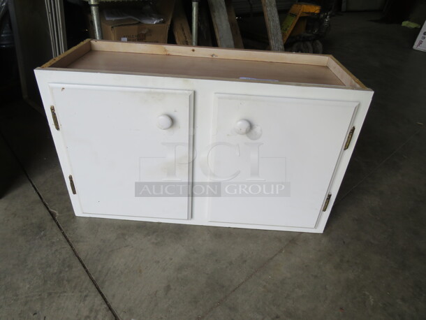 One 2 Door Cabinet. 30X13X18 - Image 1 of 2