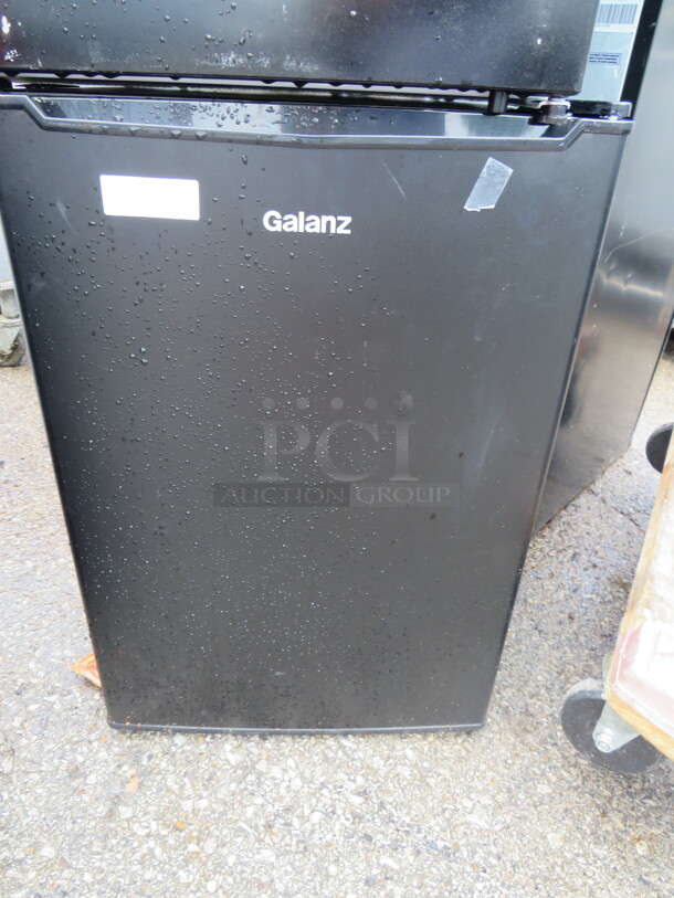 One WORKING Galanz 1 Door Cooler With 2 Racks. 120 Volt. Model# GLR25MBKE02. 17.5X19X25 - Image 1 of 1