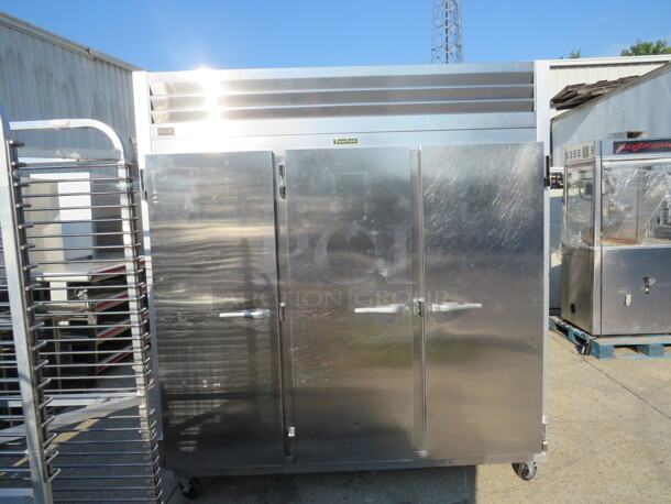ONE AWESOME WORKING 3 Door Traulsen Refrigerator With 9 Racks On Casters. Model# G30011. 115 Volt. 76.5X34X83.5. $9175.68 - Image 2 of 3