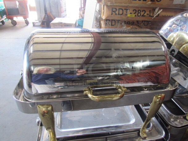 One Beautiful Roll Top Chafer With Gold Accents.