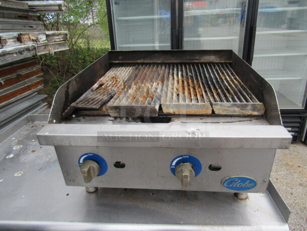 One Globe Gas Charbroiler. Broken Grate. 24X27X17