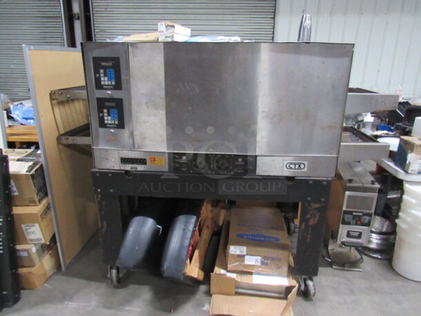 One CTX Double Stack Conveyor Pizza Oven On Casters. Model# DZ5511. 208 Volt. 3/1 Phase. 83X36X60.5