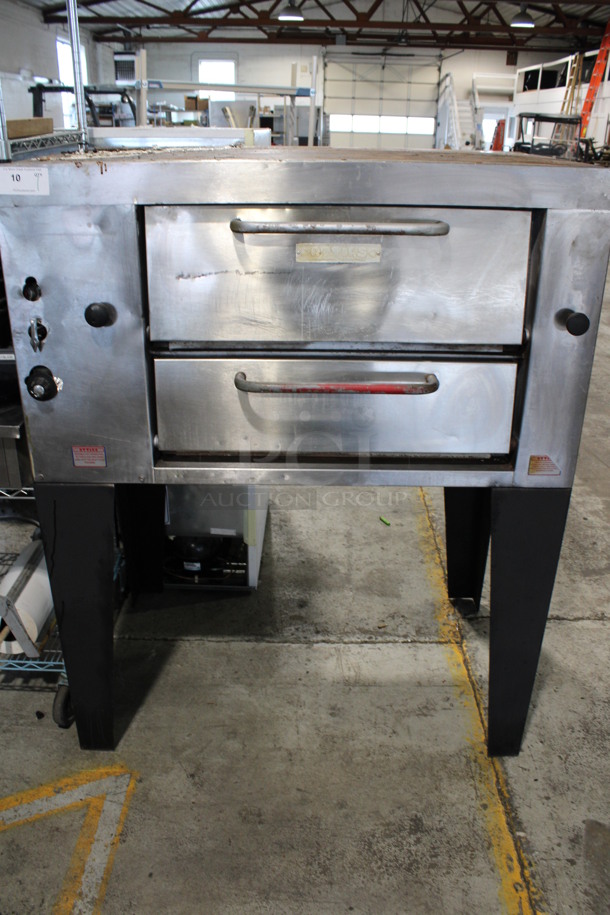 Attias Stainless Steel Commercial Natural Gas Powered Single Deck Pizza Oven on Metal Legs. 48.5x33x60