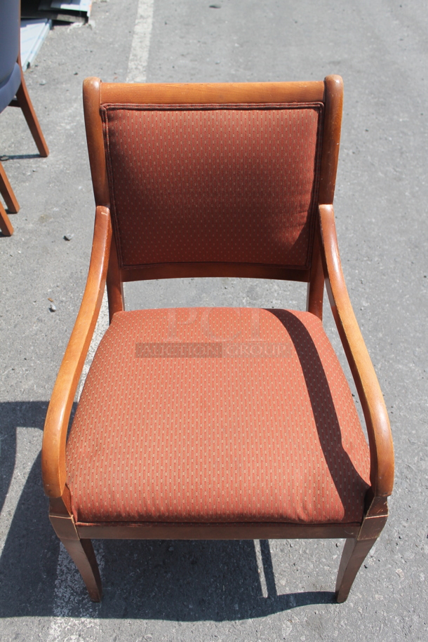 5 Wood Chairs With Orange/Red Cushioned Back And Seat. 5 Times Your Seat! Cosmetic Condition May Vary! 