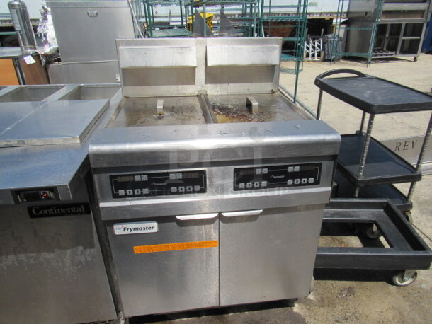 One Natural Gas Double Frymaster With Filtration On Casters. Model# FMJ250E. 31X32X46.5. $34,807.20. - Image 1 of 2