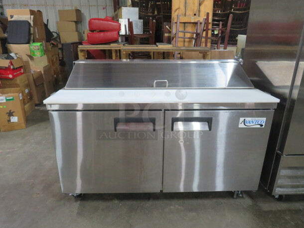 One Working Avantco 2 Door Refrigerated Prep Table With 2 Racks, And  Cutting Board On Casters. Model# 178APT60HC. 115 Volt. 60X31X43. - Image 1 of 5
