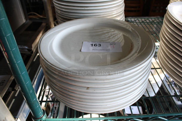 11 White Ceramic Plates. 12x12x1. 11 Times Your Bid!