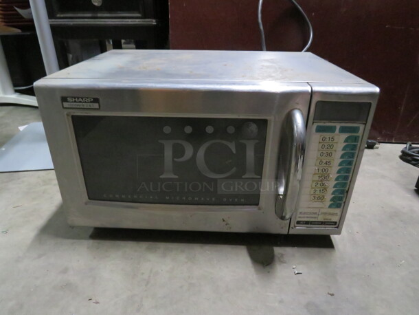 One Sharp Commercial Microwave. Model# R-21-LTF. 120 Volt. 20.5X16X12