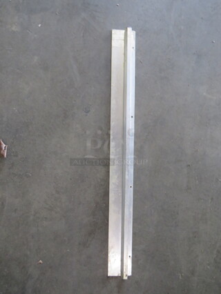 One 36 Inch Stainless Steel Ticket Rail.