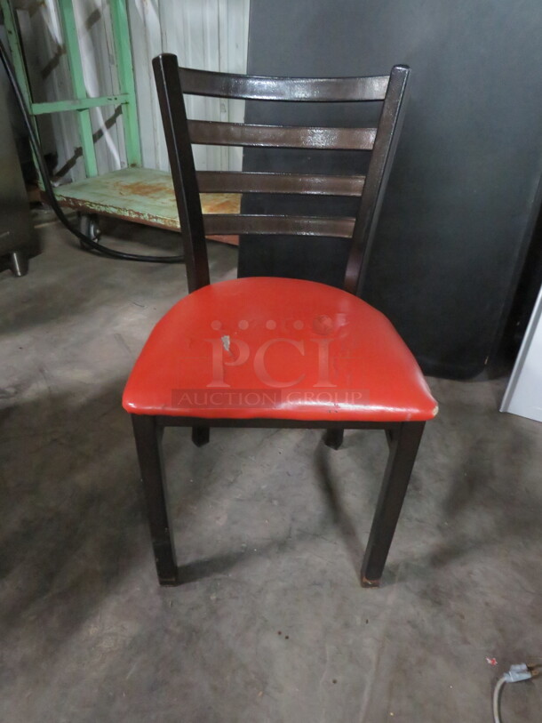 Black Metal Chair With Red Cushioned Seat. 4XBID - Image 1 of 2