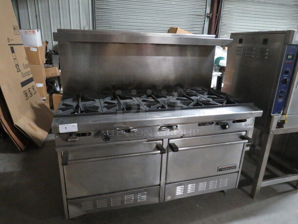 One Garland 10 Burner Natural Gas Range With Stainless Steel Over Shelf On Casters. Model# H284. 60X33X59