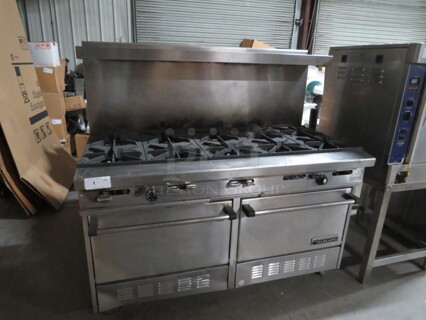 One Garland 10 Burner Natural Gas Range With Stainless Steel Over Shelf On Casters. Model# H284. 60X33X59