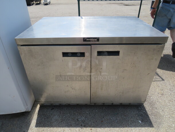 One 2 Door Delfield Under Counter Cooler With 2 Racks On Casters. Model# UC4448N. 115 Volt. 48X31.5X34 - Image 1 of 1