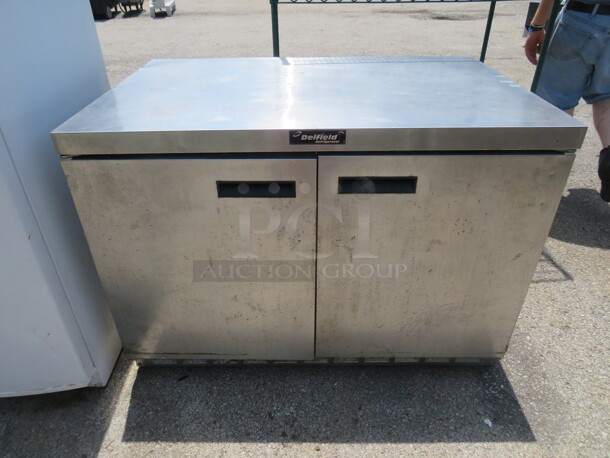 One 2 Door Delfield Under Counter Cooler With 2 Racks On Casters. Model# UC4448N. 115 Volt. 48X31.5X34