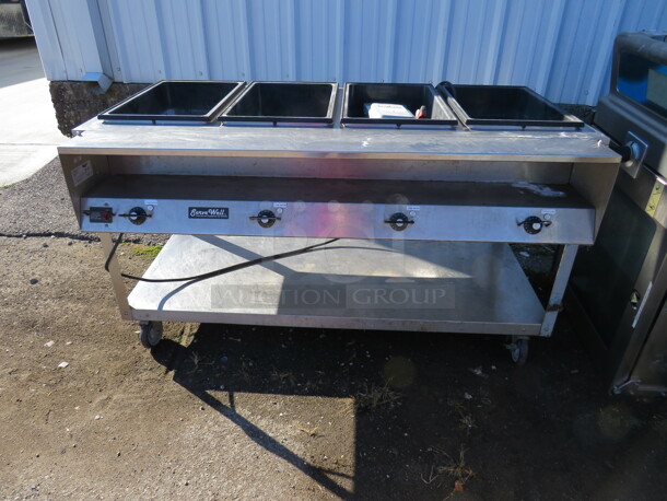 One WORKING Vollrath Serve Well Electric Four Pan Hot Food Table With Stainless Steel Under Shelf On Casters. 120 Volt. Model# 38004. 60.5X32X35. $2323.40.  - Image 1 of 2