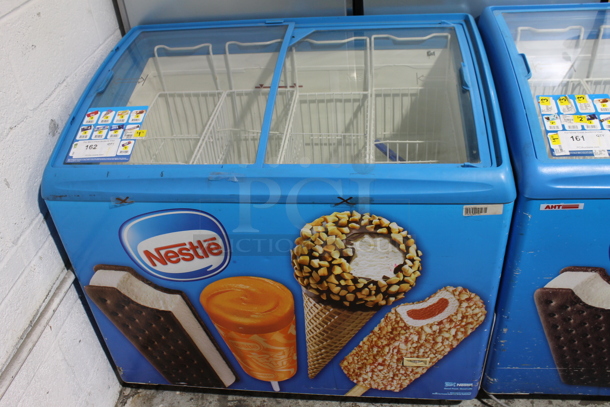 AHT RIO S 100 Metal Commercial Novelty Ice Cream Treat Freezer Merchandiser w/ Poly Baskets on Commercial Casters. 110-120 Volts, 1 Phase. - Item #1099606