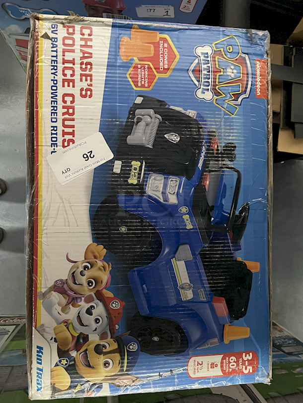 NEW IN ORIGINAL PACKAGING!! Kid Trax Nickelodeon Paw Patrol Chase's Police Cruiser 6v Battery-Powered Ride-On. Includes: 6v Battery & Charger, 2 Cones & Working Lights & Siren.  - Image 2 of 3