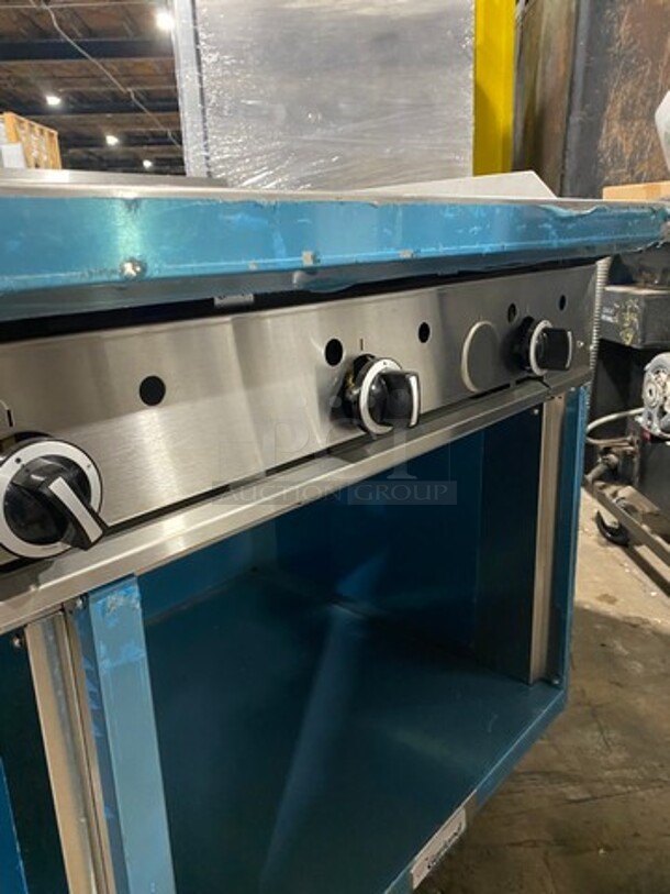 WOW! NEVER USED! Garland Commercial Natural Gas Powered 4 Burner Stove With Right Side Flat Griddle! Griddle Has Back And Side Splashes! With 2 Compartment Storage Space Underneath! All Stainless Steel! On Casters! Model: G604G36SS SN: 1712100102342 - Image 11 of 12