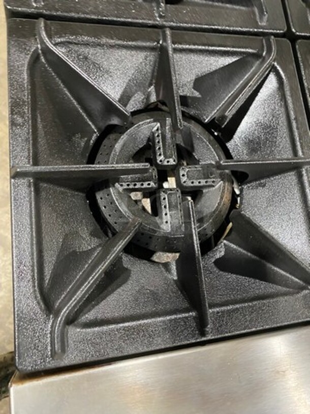 Patriot Commercial Natural Gas Powered 6 Burner Stove With Flat Griddle! Flat Griddle Has Side Splashes! With Raised Back Splash! With 2 Oven Underneath! Metal Oven Racks! All Stainless Steel! On Casters! Model: FMGR6024GNG SN: 17035100006 - Image 6 of 12