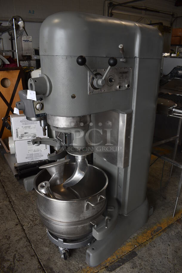 Hobart Model M-802 Metal Commercial Floor Style 80 Quart Planetary Dough Mixer w/ Stainless Steel Mixing Bowl, Bowl Dolly, 2 Dough Hooks and Paddle Attachment. 220 Volts, 3 Phase. Unit Was In Working Condition When Removed. 28x40x66