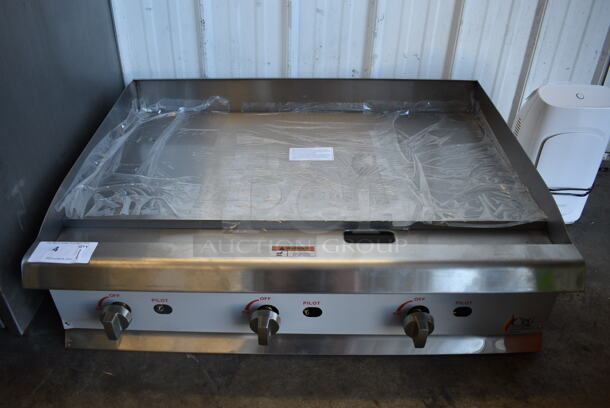 BRAND NEW! CPG 351GMCPG36NL Stainless Steel Commercial Countertop Natural Gas Powered Flat Top Griddle. Comes w/ Legs. 90,000 BTU. 36x30x13. Tested and Working!