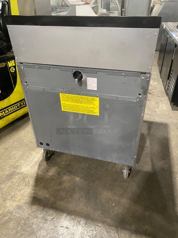 Garland Commercial Natural Gas Powered 4 Burner Stove! With Back Splash! With Oven Underneath! Metal Oven Rack! All Stainless Steel! On Casters! Model: 144R SN: 1601100100589 - Image 4 of 10