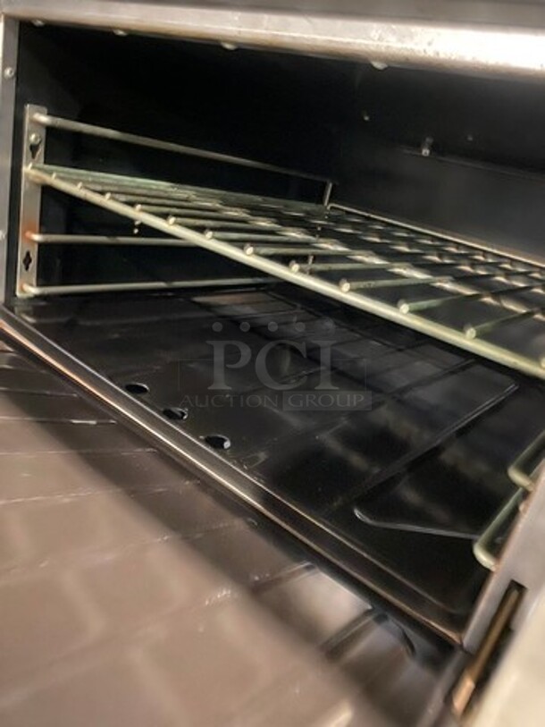 Garland Commercial Natural Gas Powered 4 Burner Stove! With Back Splash! With Oven Underneath! Metal Oven Rack! All Stainless Steel! On Casters! Model: 144R SN: 1601100100589 - Image 7 of 10