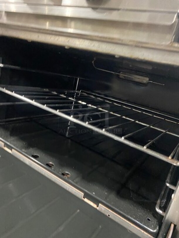Amaizing! Garland Natural Gas Powered 10 Burner Stove! With 2 Ovens! With Metal Oven Racks! With Raised Back Splash & Salamander! Stainless Steel! On Casters! Working When Removed! - Image 8 of 10