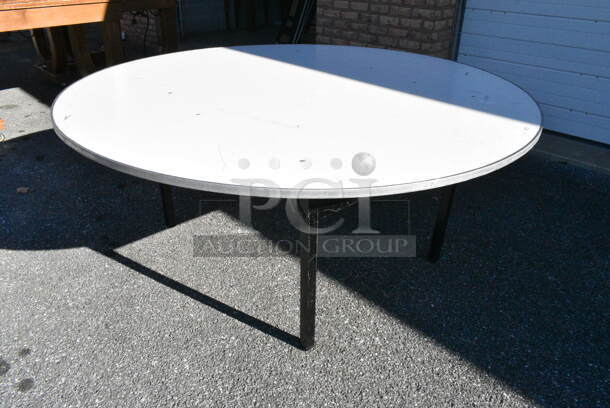 7 Round Folding Table. 7 Times Your Bid!  - Image 1 of 3