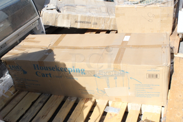 BRAND NEW SCRATCH & DENT! Lavex 274HKCARTLCK  Hotel / Housekeeping Cart - Large Locking Three Shelf. Box is damaged, handle on cart is damaged.   - Image 2 of 5