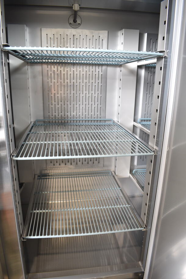 BRAND NEW SCRATCH AND DENT! 2024 Avantco 178SS3RHC Stainless Steel Commercial 3 Door Reach In Cooler w/ Poly Coated Racks on Commercial Casters. 115 Volts, 1 Phase. Tested and Working! - Image 5 of 7