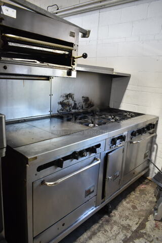 Southbend Stainless Steel Commercial Natural Gas Powered 6 Burner Range w/ Flat Top Griddle, 2 Ovens, Cheese Melter and Back Splash on Commercial Casters. 