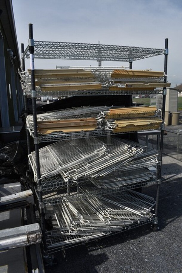 ALL ONE MONEY! Metro Chrome and Black Finish 6 Tier Shelving Unit on Commercial Casters w/ Lot of Poly Coated Racks. BUYER MUST DISMANTLE. PCI CANNOT DISMANTLE FOR SHIPPING. PLEASE CONSIDER FREIGHT CHARGES. 48x24x78 - Image 1 of 5