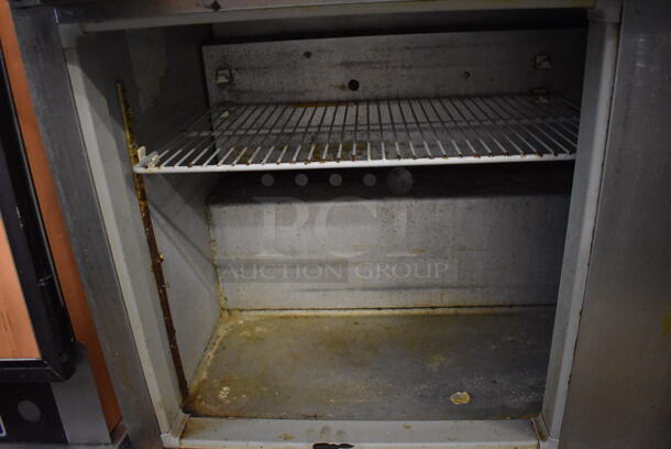 McCall Stainless Steel Commercial Sandwich Salad Prep Table Bain Marie Mega Top on Commercial Casters. One Caster and One Door Need To Be Reattached. 115 Volts, 1 Phase. 59x30x43. Tested and Powers On But Temps at 41 Degrees - Image 6 of 7
