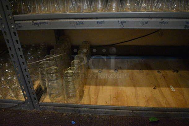 Gray Metal 5 Tier Shelving Unit w/ Contents Including Beverage Glasses and Wine Glasses. 48x24x72. BUYER MUST REMOVE; BUYER MUST DISMANTLE. PCI CANNOT DISMANTLE FOR SHIPPING. PLEASE CONSIDER FREIGHT CHARGES. (glass room - off of bar area) - Image 9 of 10